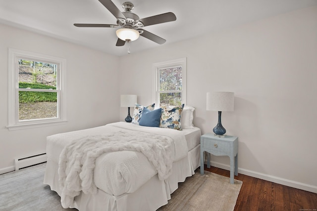 5 Edge Hill Trl, Westport, CT 06880 - bedroom featuring a baseboard radiator, multiple windows, baseboards, and wood finished floors