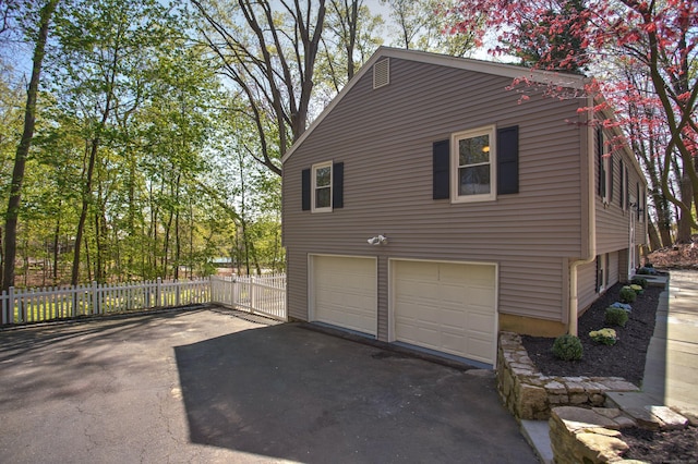5 Edge Hill Trl, Westport, CT 06880 - view of property exterior featuring driveway and an attached garage