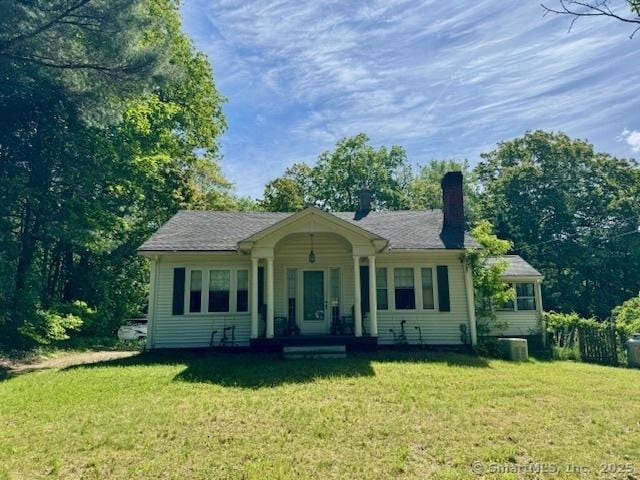 278 Colebrook River Rd, Colebrook, CT 06021 - view of front of house with a chimney, a front yard, and central air condition unit