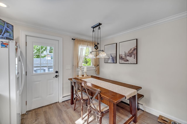 1 Freedman Dr, Norwalk, CT 06854 - dining area featuring light wood-style flooring, crown molding, a baseboard radiator, and baseboards