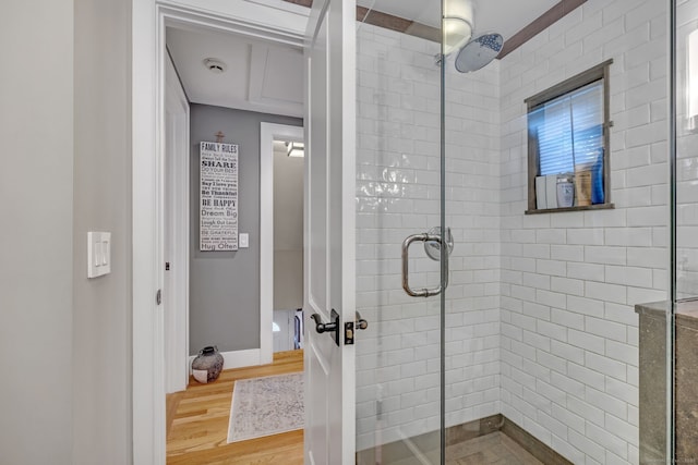 1 Freedman Dr, Norwalk, CT 06854 - full bathroom with a tile shower, wood finished floors, and baseboards