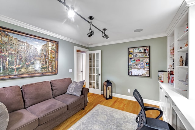 1 Freedman Dr, Norwalk, CT 06854 - home office with light wood finished floors, ornamental molding, baseboards, and track lighting