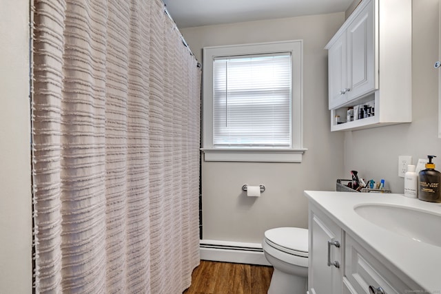 1 Freedman Dr, Norwalk, CT 06854 - full bath with a baseboard radiator, wood finished floors, toilet, vanity, and a shower with curtain