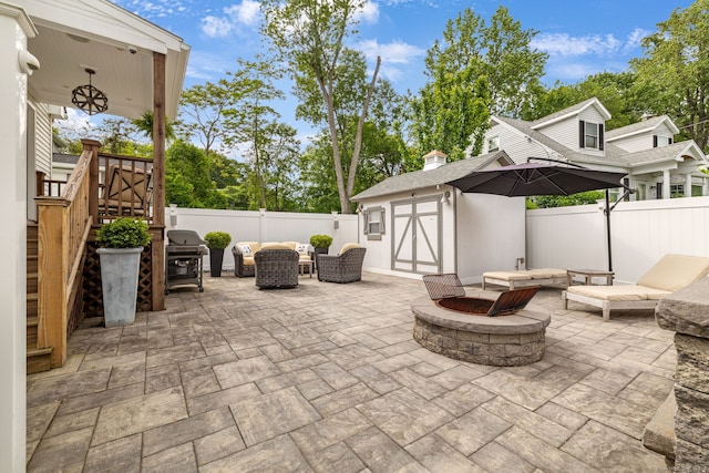 1 Freedman Dr, Norwalk, CT 06854 - fenced backyard with a fire pit, a patio, and area for grilling