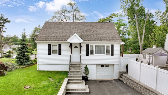 1 Freedman Dr, Norwalk, CT 06854 - view of front of house featuring a garage, a shingled roof, and driveway