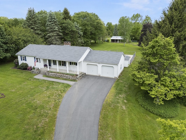 176 Prospect Hill Rd, Colchester, CT 06415 - view of front of house with an attached garage, a porch, driveway, a shingled roof, and a chimney