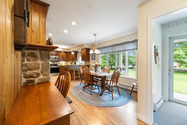 176 Prospect Hill Rd, Colchester, CT 06415 - dining area featuring a baseboard heating unit, a textured ceiling, light wood-style flooring, recessed lighting, and a chandelier