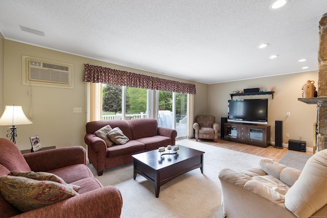 176 Prospect Hill Rd, Colchester, CT 06415 - living room with an AC wall unit, a textured ceiling, recessed lighting, crown molding, and light wood finished floors