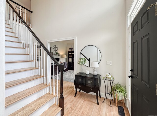 67 Melissa Ln, Prospect, CT 06712 - foyer entrance featuring a towering ceiling, stairs, and light wood finished floors
