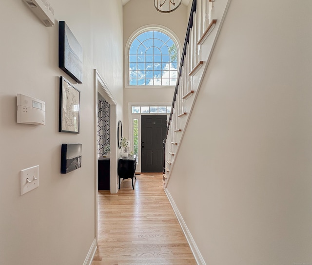 67 Melissa Ln, Prospect, CT 06712 - foyer featuring stairs, healthy amount of natural light, light wood-style flooring, and a high ceiling