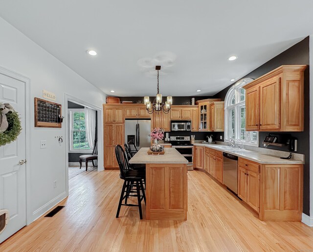 67 Melissa Ln, Prospect, CT 06712 - kitchen featuring stainless steel appliances, a chandelier, a breakfast bar, healthy amount of natural light, and recessed lighting