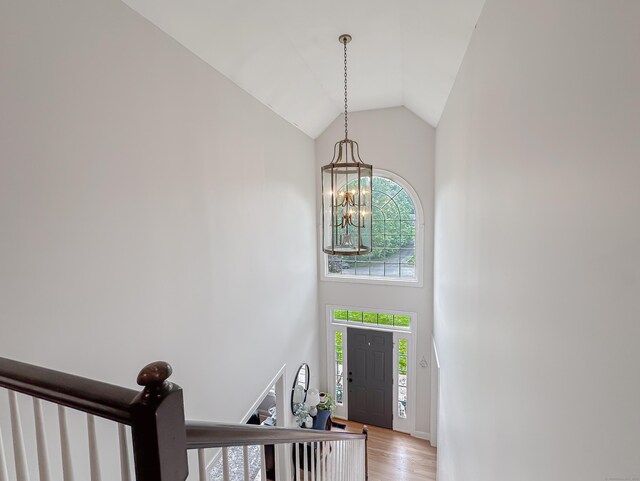 67 Melissa Ln, Prospect, CT 06712 - foyer with a chandelier, high vaulted ceiling, light wood-style flooring, and stairway