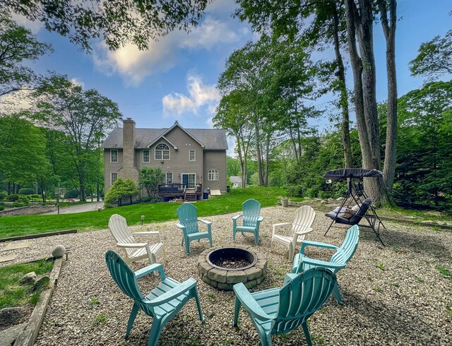67 Melissa Ln, Prospect, CT 06712 - view of grassy yard featuring a fire pit and a deck