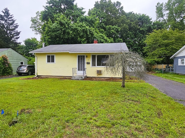 30 Hardwood Rd, Plainville, CT 06062 - view of front of home with a front yard and a chimney