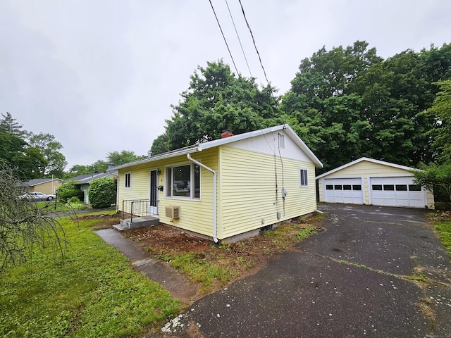 30 Hardwood Rd, Plainville, CT 06062 - view of front facade featuring a detached garage and an outdoor structure