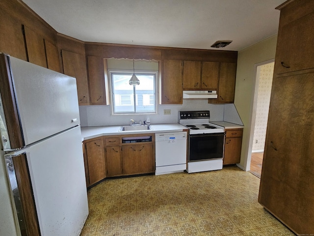 30 Hardwood Rd, Plainville, CT 06062 - kitchen with white appliances, under cabinet range hood, a sink, light countertops, and light floors