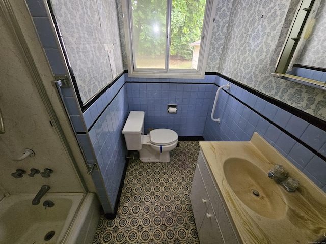 30 Hardwood Rd, Plainville, CT 06062 - bathroom with wallpapered walls, a wainscoted wall, vanity, toilet, and shower / tub combination
