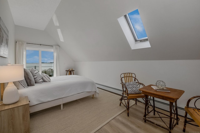 35 Soundview Ave, Old Saybrook, CT 06475 - bedroom with a skylight, lofted ceiling, wood finished floors, a water view, and a baseboard radiator