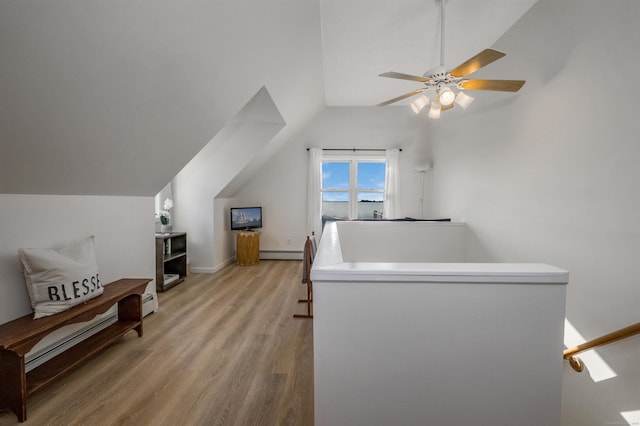35 Soundview Ave, Old Saybrook, CT 06475 - bedroom with lofted ceiling, a baseboard radiator, light wood-type flooring, ceiling fan, and baseboards