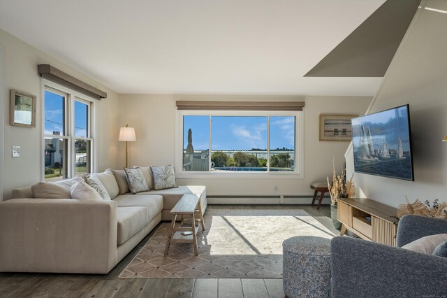 35 Soundview Ave, Old Saybrook, CT 06475 - living area featuring a baseboard heating unit, plenty of natural light, and dark wood-style floors