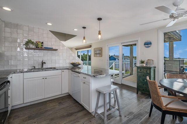 35 Soundview Ave, Old Saybrook, CT 06475 - kitchen with dishwasher, open shelves, a peninsula, tasteful backsplash, and a sink