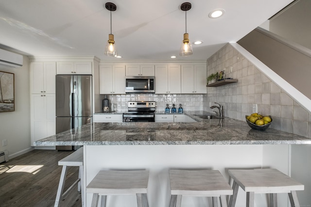 35 Soundview Ave, Old Saybrook, CT 06475 - kitchen with appliances with stainless steel finishes, a sink, white cabinetry, backsplash, and recessed lighting