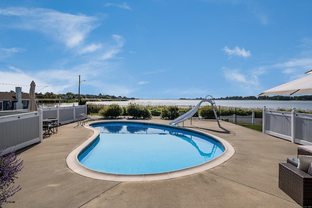 35 Soundview Ave, Old Saybrook, CT 06475 - view of swimming pool with a water slide, a patio area, and a water view