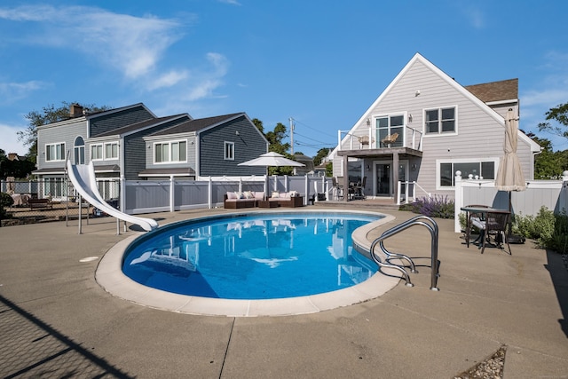 35 Soundview Ave, Old Saybrook, CT 06475 - view of pool with a water slide, an outdoor hangout area, and a patio