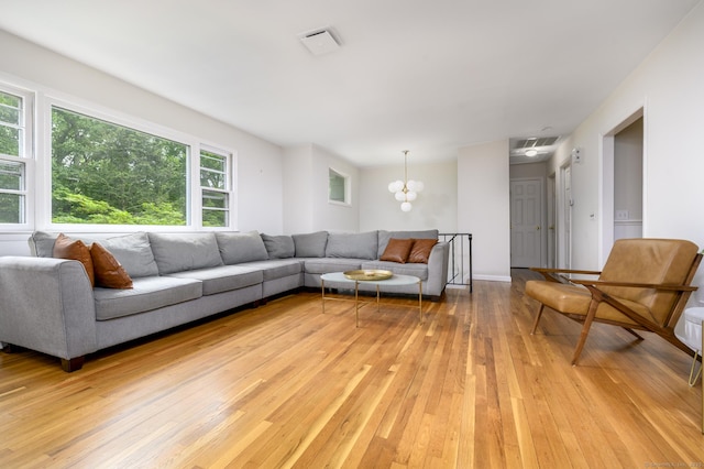 525 Bennetts Farm Rd, Ridgefield, CT 06877 - living room with light wood finished floors and a chandelier
