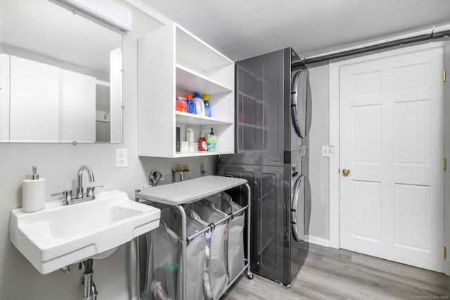 525 Bennetts Farm Rd, Ridgefield, CT 06877 - laundry area featuring stacked washer and clothes dryer and light wood-style floors