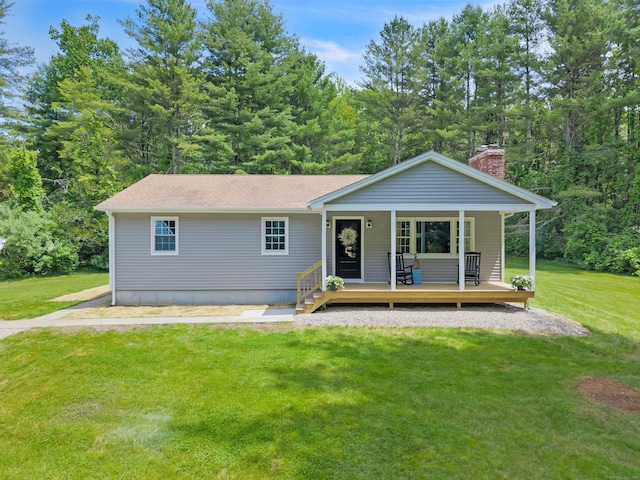 53 Pratt Rd, Plainfield, CT 06374 - view of front of house featuring a front lawn, a chimney, covered porch, and a shingled roof