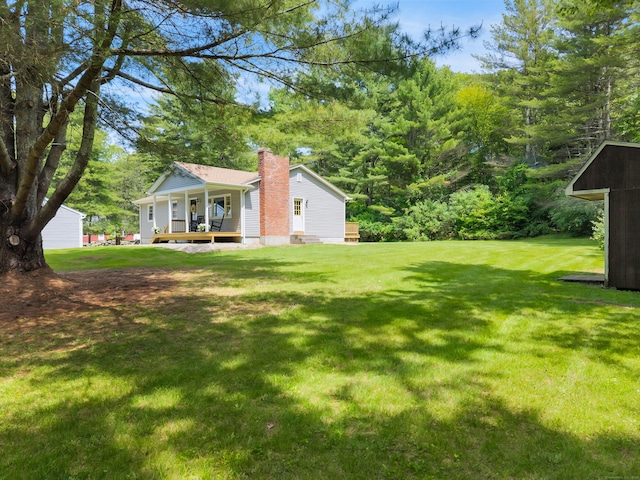 53 Pratt Rd, Plainfield, CT 06374 - view of grassy yard with covered porch and an outdoor structure