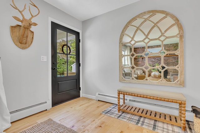 53 Pratt Rd, Plainfield, CT 06374 - entryway featuring baseboard heating, wood finished floors, and baseboards