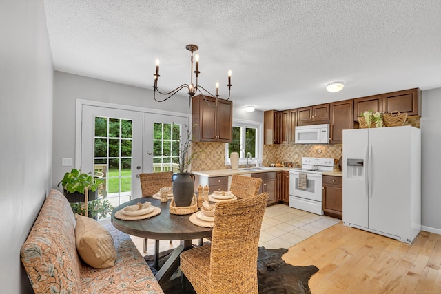 53 Pratt Rd, Plainfield, CT 06374 - kitchen featuring white appliances, a sink, light countertops, tasteful backsplash, and a textured ceiling