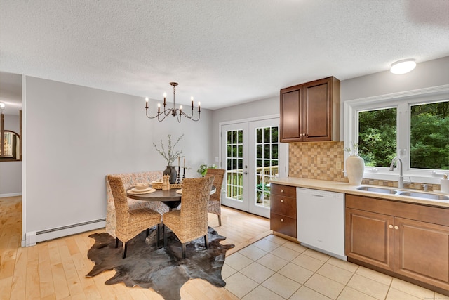 53 Pratt Rd, Plainfield, CT 06374 - dining room with baseboard heating, a chandelier, french doors, plenty of natural light, and a textured ceiling