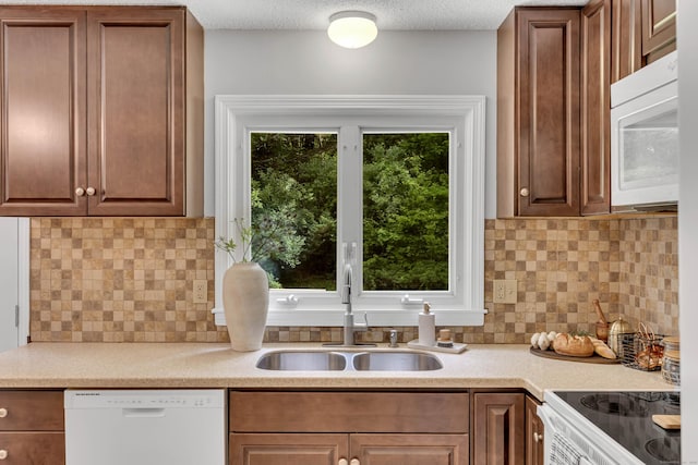 53 Pratt Rd, Plainfield, CT 06374 - kitchen with white appliances, a sink, light countertops, and backsplash