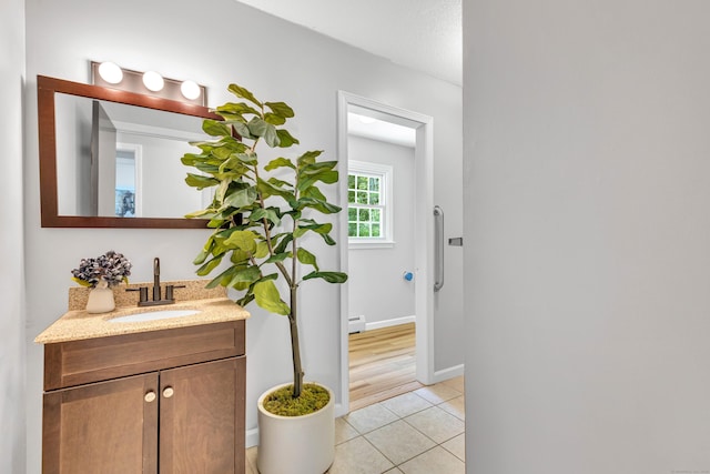 53 Pratt Rd, Plainfield, CT 06374 - bathroom with vanity, tile patterned flooring, a baseboard radiator, and baseboards