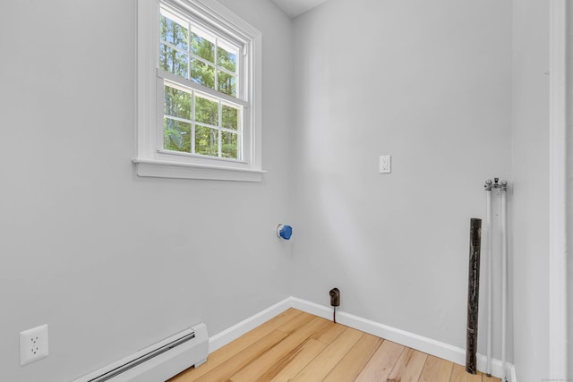 53 Pratt Rd, Plainfield, CT 06374 - laundry area with a baseboard heating unit, wood finished floors, and baseboards