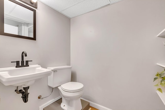 53 Pratt Rd, Plainfield, CT 06374 - half bath with toilet, a paneled ceiling, and baseboards