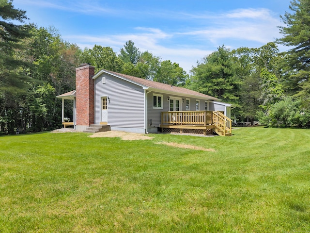 53 Pratt Rd, Plainfield, CT 06374 - rear view of house featuring a chimney, a yard, and a wooden deck