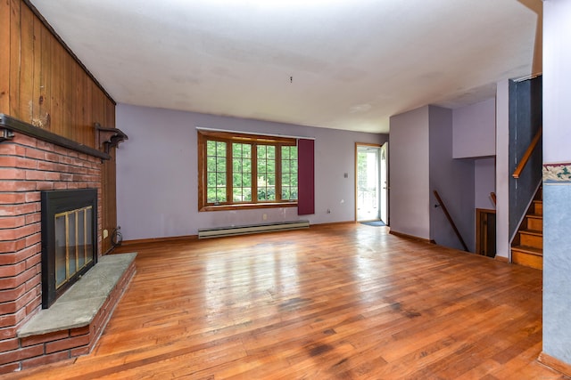 10 Meeting House Rd, Barkhamsted, CT 06063 - unfurnished living room featuring a baseboard heating unit, light wood finished floors, a fireplace, and baseboards