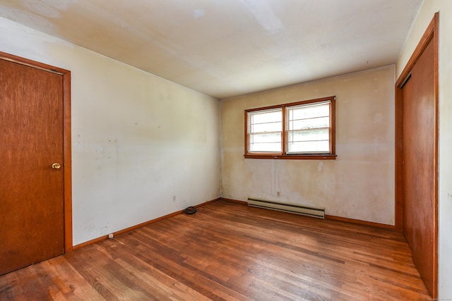 10 Meeting House Rd, Barkhamsted, CT 06063 - unfurnished bedroom with baseboard heating, wood finished floors, and baseboards