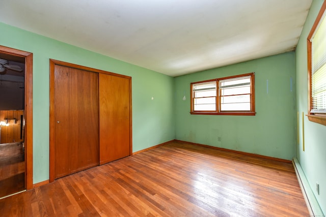 10 Meeting House Rd, Barkhamsted, CT 06063 - unfurnished bedroom featuring a baseboard radiator, wood finished floors, and baseboards