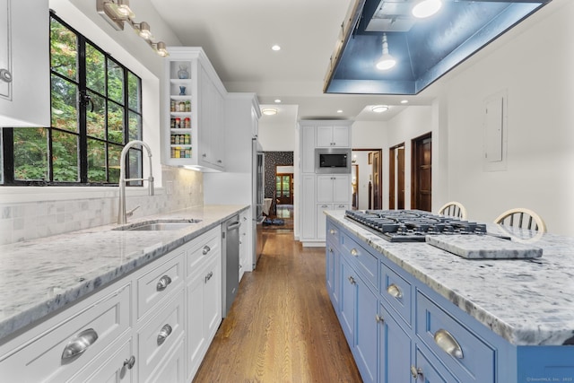 20 Cook Rd, Stamford, CT 06902 - kitchen with a sink, blue cabinetry, stainless steel appliances, white cabinets, and dark wood-type flooring