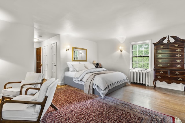 20 Cook Rd, Stamford, CT 06902 - bedroom with radiator heating unit and wood finished floors