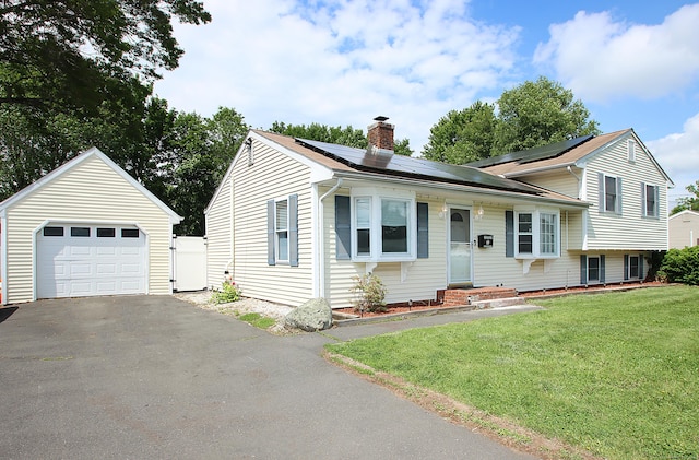 537 Hobart St, Southington, CT 06489 - tri-level home with a chimney, a front yard, solar panels, a garage, and driveway