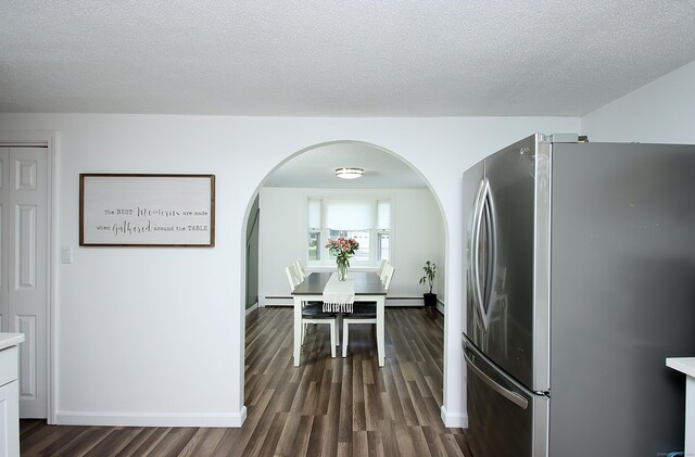 537 Hobart St, Southington, CT 06489 - kitchen featuring freestanding refrigerator, dark wood finished floors, arched walkways, baseboards, and a textured ceiling