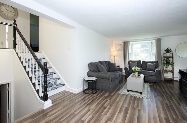 537 Hobart St, Southington, CT 06489 - living area featuring wood finished floors, baseboard heating, stairway, and baseboards