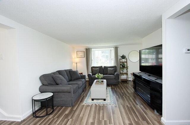 537 Hobart St, Southington, CT 06489 - living area featuring wood finished floors and baseboards