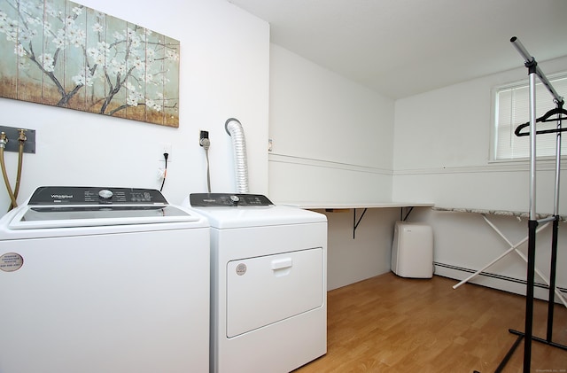 537 Hobart St, Southington, CT 06489 - washroom featuring washer and clothes dryer, light wood-style flooring, and a baseboard radiator